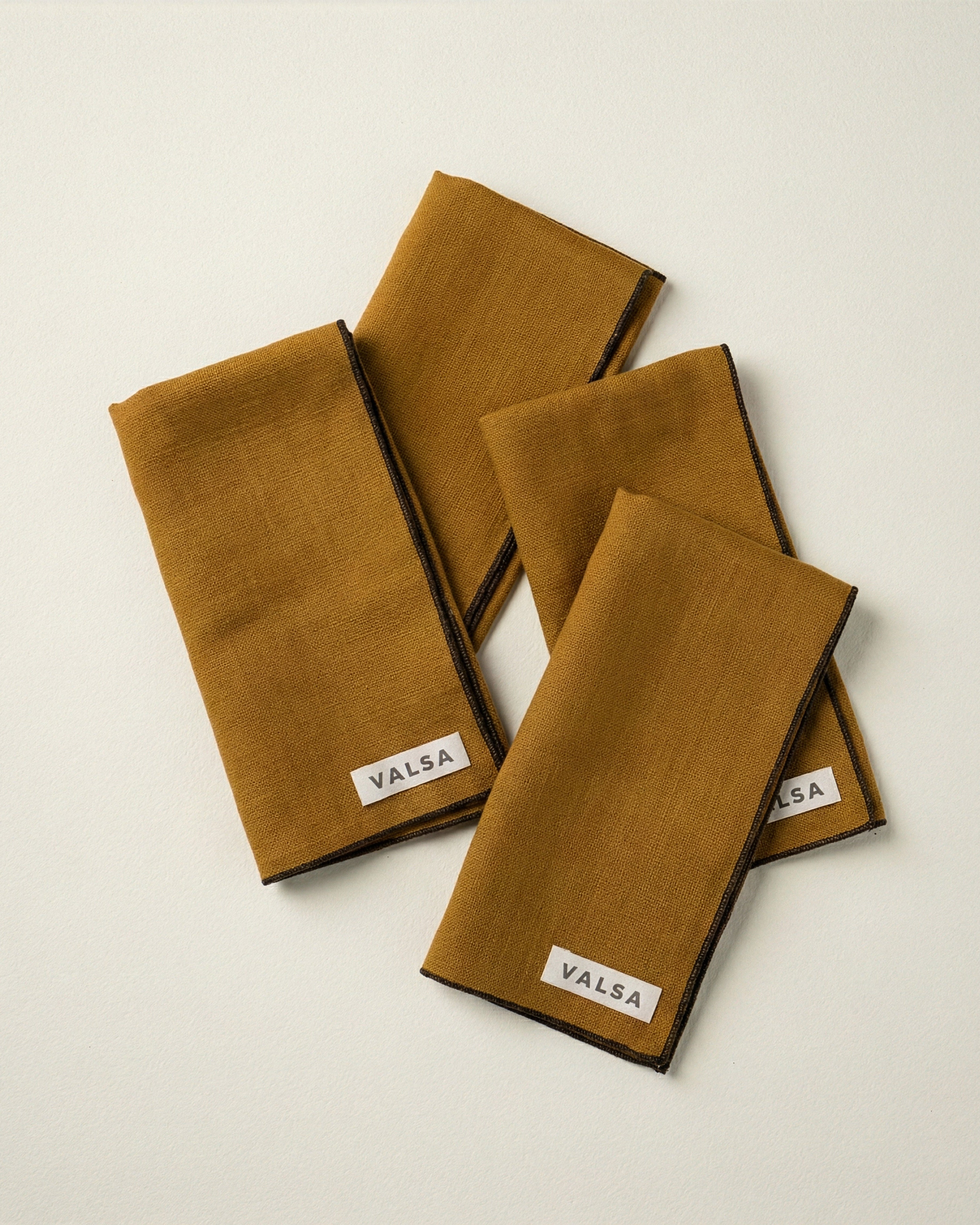 Valsa Home Linen Napkin - Ochre Yellow with black border.